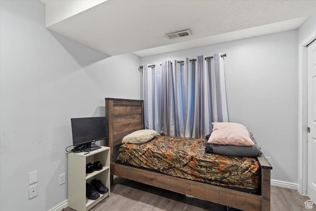 6268 S Faber Ln, Taylorsville, UT 84123 - bedroom featuring visible vents, baseboards, and wood finished floors