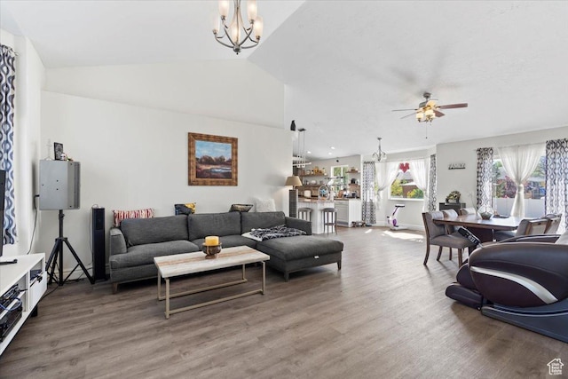 6268 S Faber Ln, Taylorsville, UT 84123 - living area featuring baseboards, ceiling fan with notable chandelier, wood finished floors, and lofted ceiling