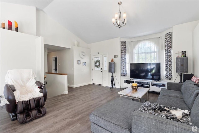 6268 S Faber Ln, Taylorsville, UT 84123 - living area with baseboards, wood finished floors, a notable chandelier, and high vaulted ceiling