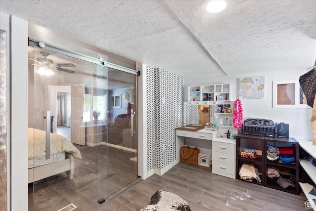 6268 S Faber Ln, Taylorsville, UT 84123 - bathroom with a ceiling fan, a textured ceiling, and wood finished floors