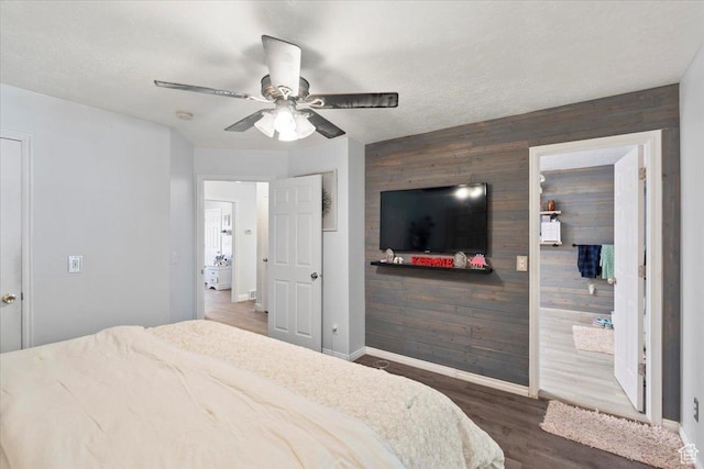 6268 S Faber Ln, Taylorsville, UT 84123 - bedroom featuring baseboards, an accent wall, wood finished floors, and wooden walls