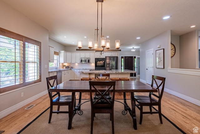 11606 S Radience Ln W, South Jordan, UT 84009 - dining space with light wood-type flooring and recessed lighting