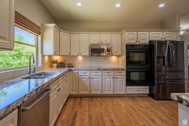 11606 S Radience Ln W, South Jordan, UT 84009 - kitchen featuring appliances with stainless steel finishes, recessed lighting, light wood finished floors, backsplash, and light stone countertops