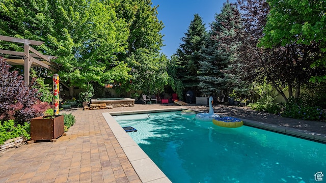 11606 S Radience Ln W, South Jordan, UT 84009 - swimming pool featuring a patio and a hot tub