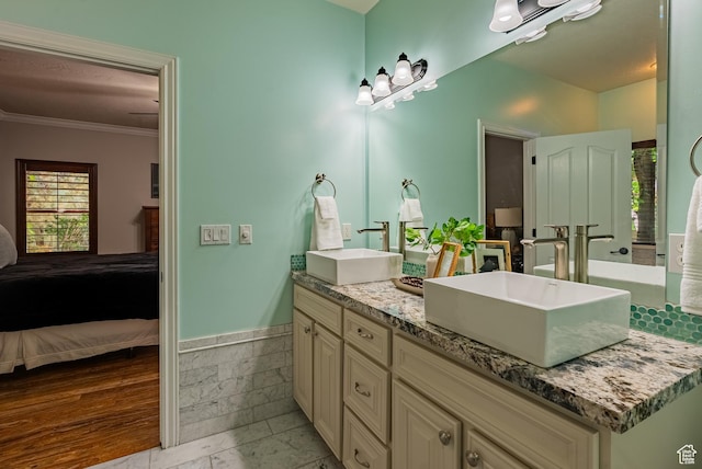 11606 S Radience Ln W, South Jordan, UT 84009 - ensuite bathroom featuring double vanity, ornamental molding, and wainscoting