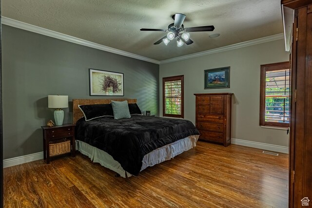 11606 S Radience Ln W, South Jordan, UT 84009 - bedroom with dark wood-type flooring, ornamental molding, a ceiling fan, and a textured ceiling