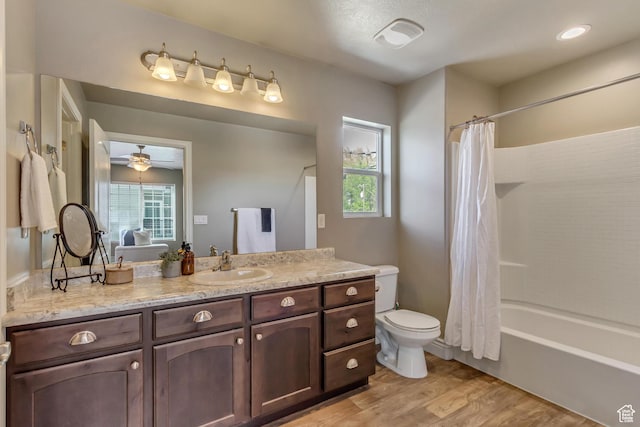 145 E Majestic Elms Pl S, South Salt Lake, UT 84115 - full bath with shower / tub combo with curtain, vanity, toilet, a ceiling fan, and wood finished floors