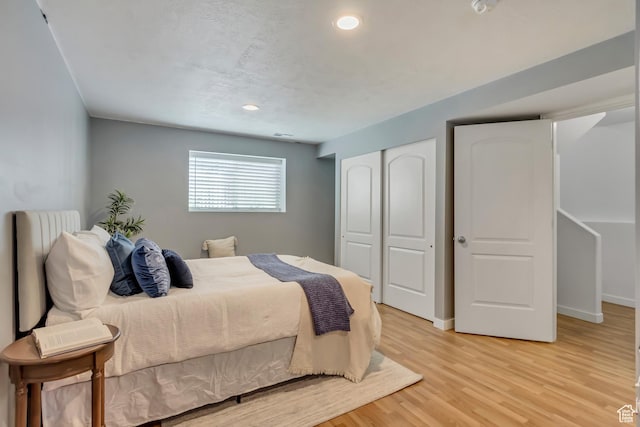 145 E Majestic Elms Pl S, South Salt Lake, UT 84115 - bedroom featuring recessed lighting, baseboards, a closet, and light wood finished floors