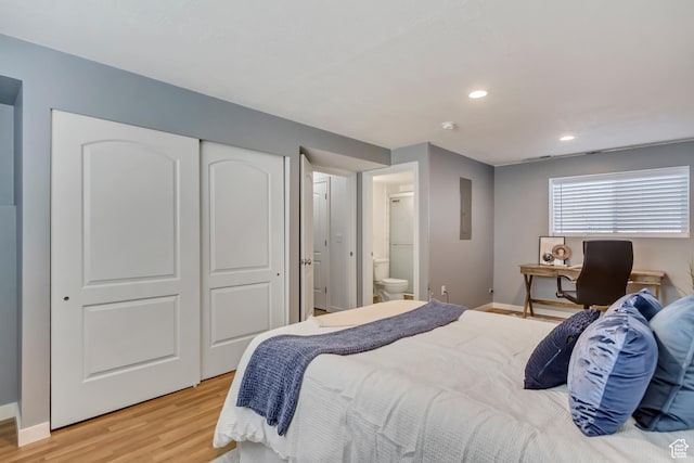 145 E Majestic Elms Pl S, South Salt Lake, UT 84115 - bedroom with a closet, light wood-style floors, baseboards, ensuite bathroom, and recessed lighting