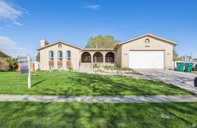 mediterranean / spanish-style home with a garage, a chimney, brick siding, a porch, and driveway