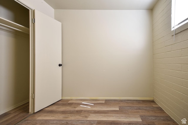 unfurnished bedroom with wood finished floors