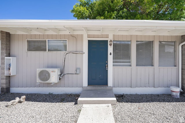 doorway to property with ac unit