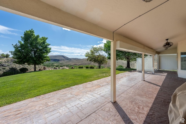 view of patio / terrace featuring a mountain view