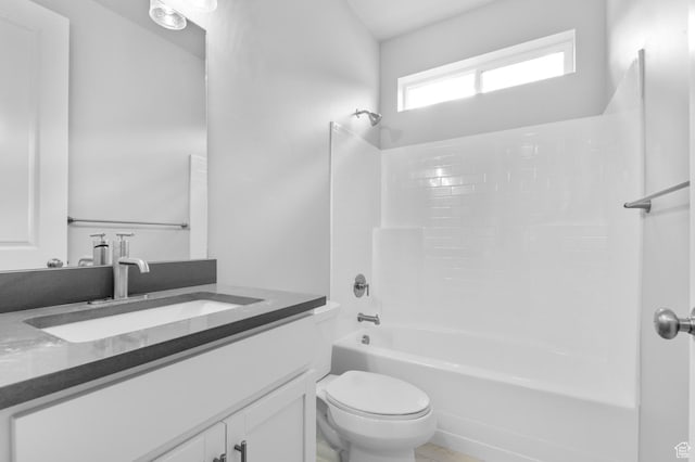 bathroom with toilet, shower / bath combination, and vanity