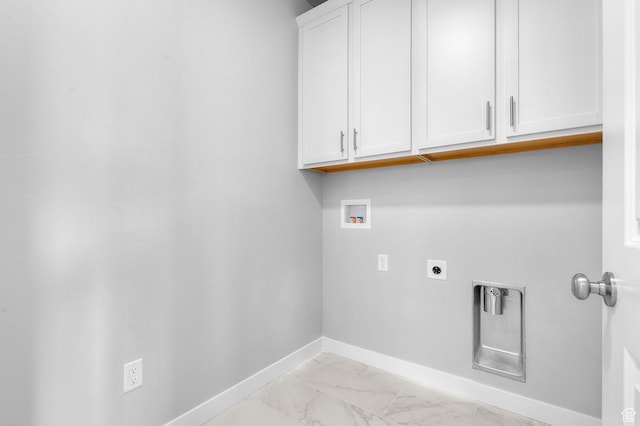 washroom with cabinet space, hookup for a washing machine, electric dryer hookup, baseboards, and light marble finish floors