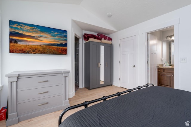 2046 W 1100 N, Provo, UT 84604 - bedroom featuring connected bathroom, vaulted ceiling, and light wood-style floors