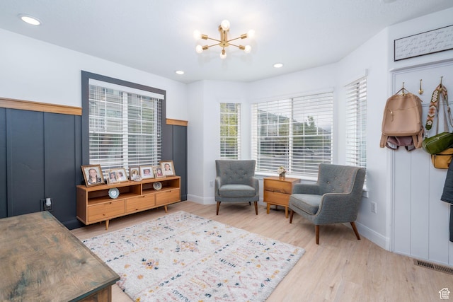 2046 W 1100 N, Provo, UT 84604 - living area featuring visible vents, wood finished floors, baseboards, an inviting chandelier, and recessed lighting