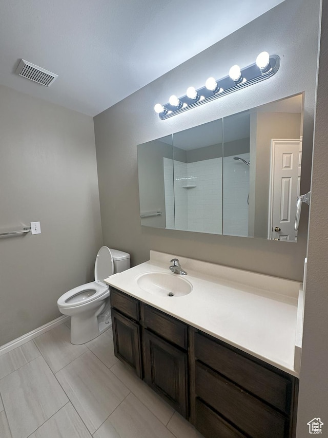 498 N 80 W, Lindon, UT 84042 - bathroom with visible vents, walk in shower, vanity, baseboards, and toilet
