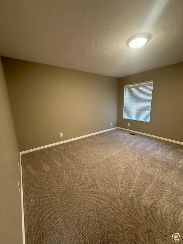 498 N 80 W, Lindon, UT 84042 - spare room with baseboards, a textured ceiling, carpet, and visible vents