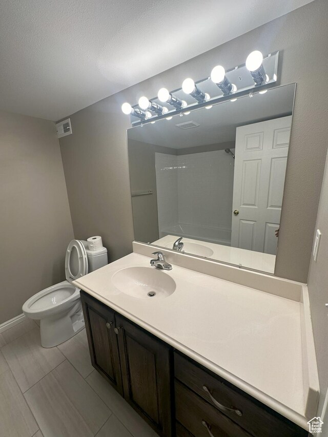 498 N 80 W, Lindon, UT 84042 - full bath with toilet, baseboards, visible vents, and vanity