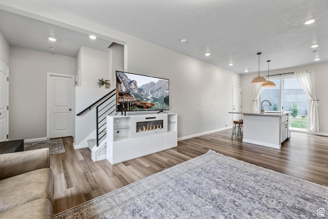 134 E Stroll Ave Unit 816, Saratoga Springs, UT 84045 - living area featuring recessed lighting, stairs, baseboards, and wood finished floors