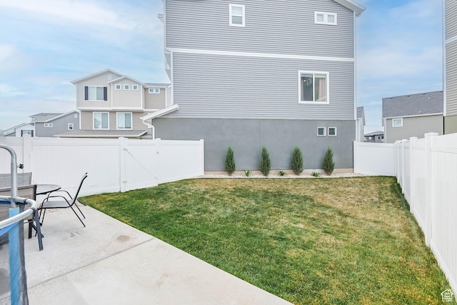 134 E Stroll Ave Unit 816, Saratoga Springs, UT 84045 - view of yard featuring a fenced backyard, a gate, and a patio