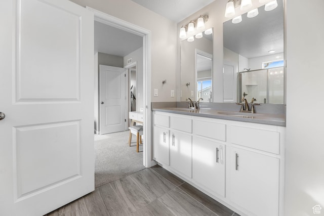 134 E Stroll Ave Unit 816, Saratoga Springs, UT 84045 - full bathroom with a sink, double vanity, a shower with shower door, and wood finished floors