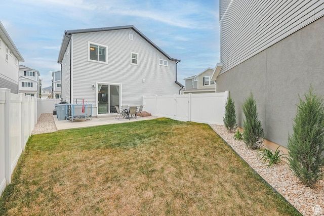 134 E Stroll Ave Unit 816, Saratoga Springs, UT 84045 - back of property with a yard, a patio, and a fenced backyard