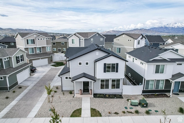 aerial view featuring a mountain view and a residential view