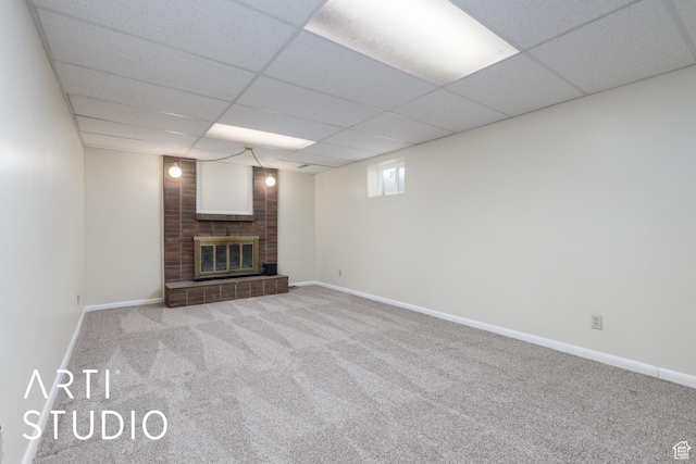 2732 S 4550 W, Taylor, UT 84401 - unfurnished living room with a brick fireplace, baseboards, a paneled ceiling, and carpet