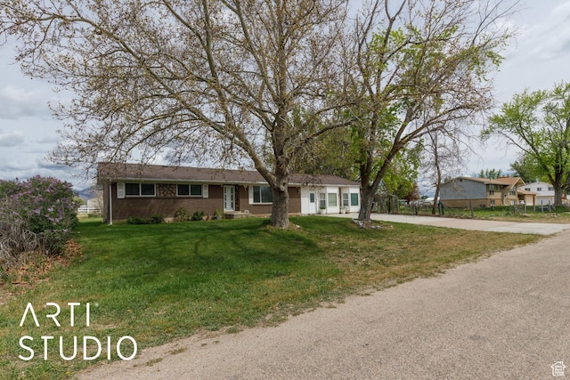 2732 S 4550 W, Taylor, UT 84401 - single story home with driveway, a front lawn, and brick siding