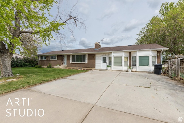 2732 S 4550 W, Taylor, UT 84401 - ranch-style home with fence, driveway, a chimney, and a front lawn