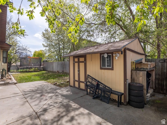 2265 W Marvinwood Dr S, Taylorsville, UT 84129 - view of outbuilding with an outbuilding, a fenced backyard, and a trampoline