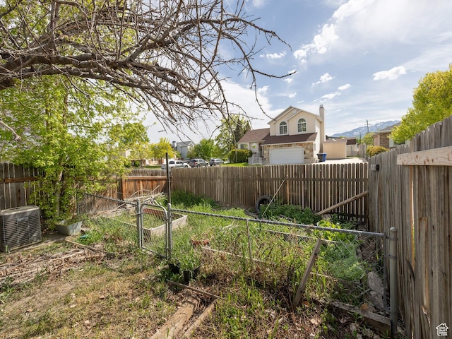 2265 W Marvinwood Dr S, Taylorsville, UT 84129 - view of yard featuring a fenced backyard and central AC