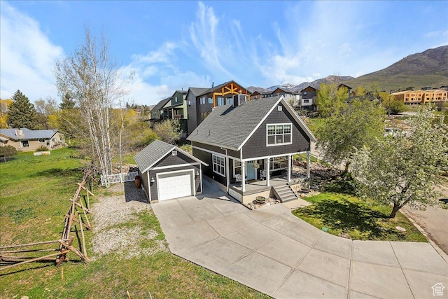3511 N Willow Creek Ln E Unit 10, Eden, UT 84310 - view of front of home featuring fence, a residential view, a front yard, covered porch, and driveway