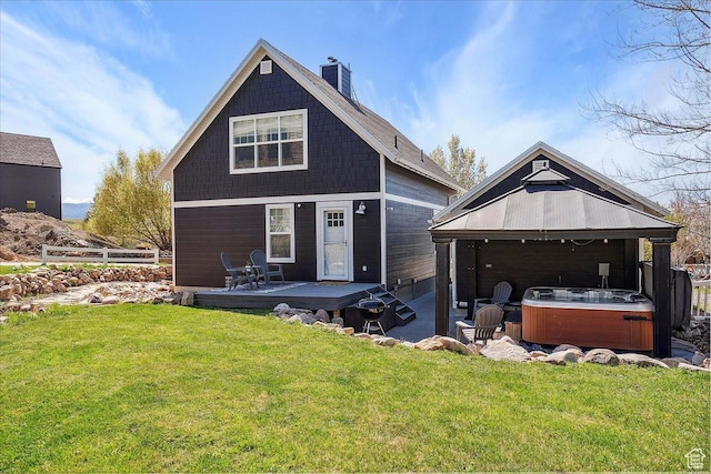 3511 N Willow Creek Ln E Unit 10, Eden, UT 84310 - rear view of property featuring a chimney, a lawn, a wooden deck, a hot tub, and a gazebo