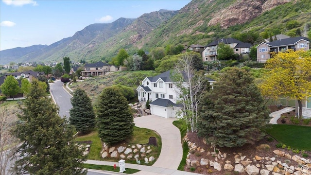birds eye view of property featuring a mountain view and a residential view