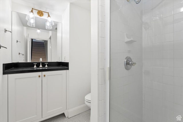 full bathroom with tile patterned floors, vanity, toilet, and a shower stall