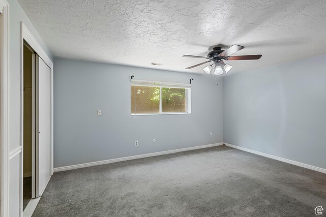 639 N University Ave Unit 2, Provo, UT 84601 - unfurnished bedroom with baseboards, carpet flooring, a textured ceiling, and visible vents