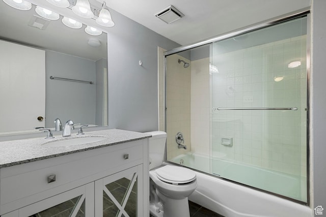 639 N University Ave Unit 2, Provo, UT 84601 - bathroom with visible vents, tile patterned flooring, vanity, toilet, and shower / bath combination with glass door