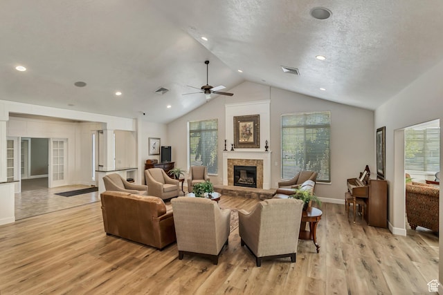 1889 S 910 W Unit B, Syracuse, UT 84075 - living room with plenty of natural light, light wood-style floors, lofted ceiling, and a stone fireplace