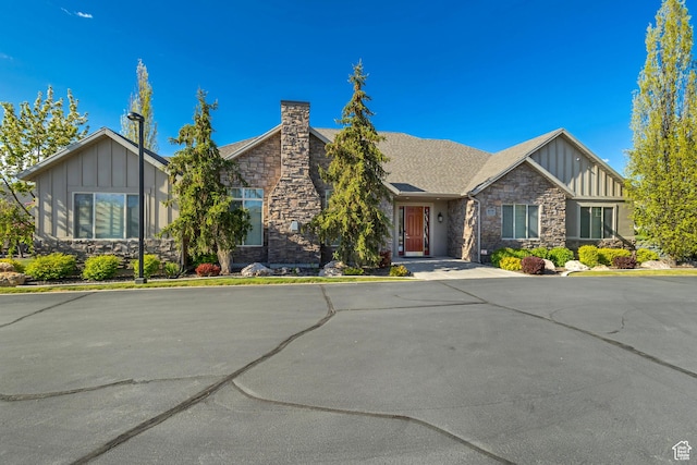 1889 S 910 W Unit B, Syracuse, UT 84075 - ranch-style home with board and batten siding, a chimney, and stone siding