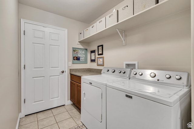 1889 S 910 W Unit B, Syracuse, UT 84075 - laundry area with baseboards, cabinet space, light tile patterned flooring, and washer and dryer