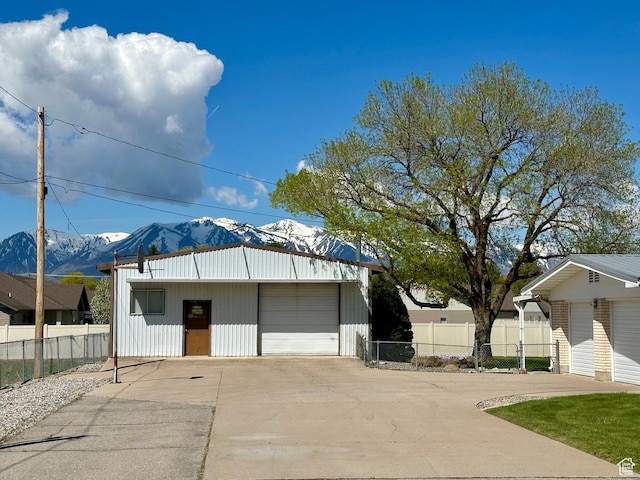 56 S 700 E, Hyrum, UT 84319 - detached garage with a mountain view, fence, and concrete driveway