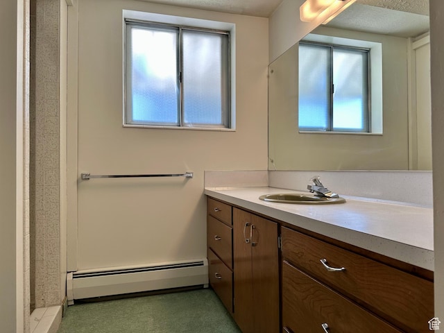 56 S 700 E, Hyrum, UT 84319 - bathroom featuring baseboard heating, vanity, and a shower