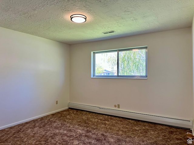 56 S 700 E, Hyrum, UT 84319 - carpeted spare room featuring baseboard heating, baseboards, and a textured ceiling