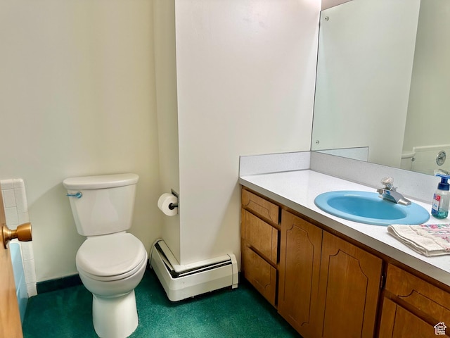 56 S 700 E, Hyrum, UT 84319 - bathroom with baseboard heating, toilet, vanity, and baseboards