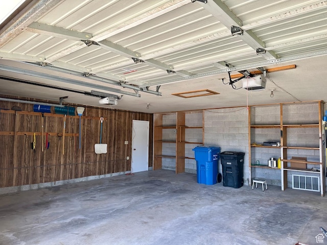 56 S 700 E, Hyrum, UT 84319 - garage with a garage door opener and wooden walls