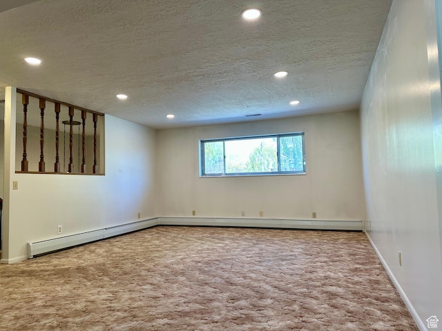 56 S 700 E, Hyrum, UT 84319 - empty room featuring carpet flooring, a textured ceiling, recessed lighting, baseboards, and a baseboard heating unit