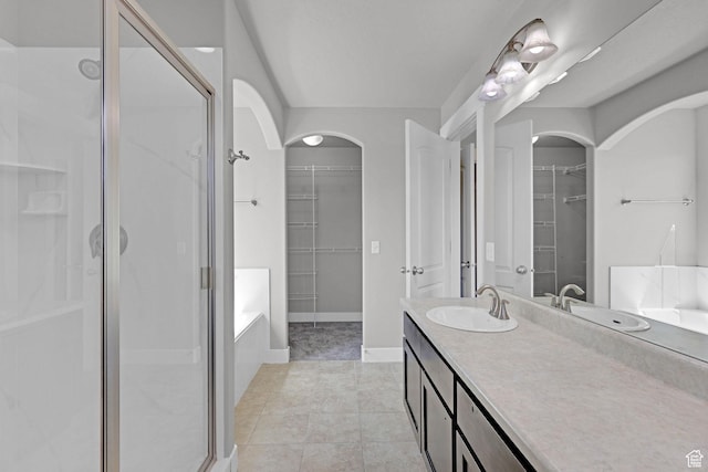 1350 S 849 W Unit 17D, Springville, UT 84663 - full bath with a shower stall, a spacious closet, vanity, a bath, and tile patterned floors
